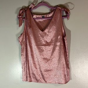 sleeveless satin monotone animal print blouse with bow tie details on shoulders